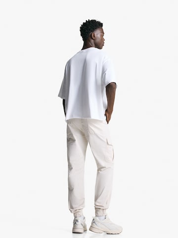 Bershka Tapered Cargo nadrágok - sárga