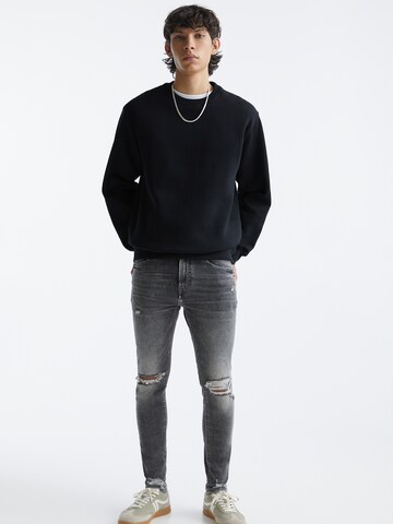 Skinny Jeans de la Pull&Bear pe gri