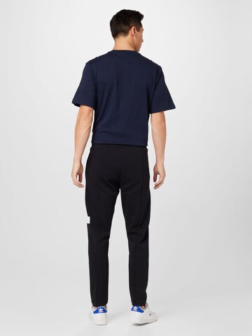 ADIDAS SPORTSWEAR Tapered Sports trousers 'Future Icons Badge Of Sport' in Black