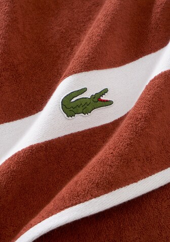 LACOSTE Towel in Orange