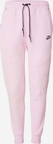Nike Sportswear Tapered Housut 'TCH FLC' värissä vaaleanpunainen: etupuoli