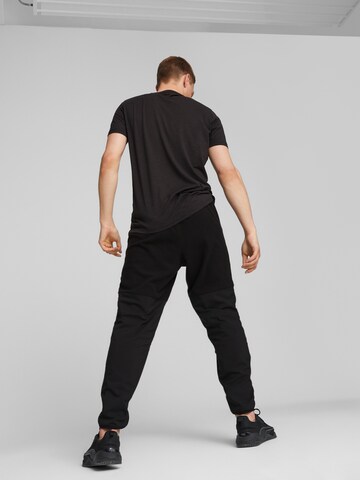 PUMA Zwężany krój Spodnie sportowe 'Fit Hybrid' w kolorze czarny