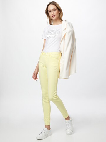 GUESS Slim fit Jeans 'CURVE X' in Yellow