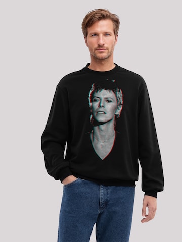 F4NT4STIC Sweatshirt 'TV Times Pop Star David Bowie Portrait 1977' in Zwart: voorkant