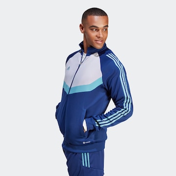 ADIDAS SPORTSWEAR Спортна жилетка с качулка 'Tiro' в синьо