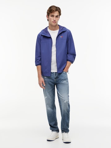 Tommy Jeans Tussenjas 'CHICAGO' in Blauw