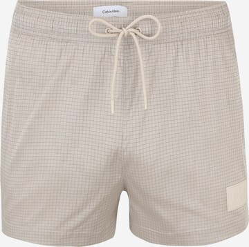 Calvin Klein Swimwear Board Shorts in Beige: front