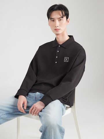 Calvin Klein - Camiseta en negro: frente