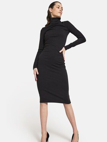 Squad the label Knitted dress 'Turtleneck Ripped' in Black: front