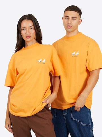 T-Shirt Legacy Studios en orange