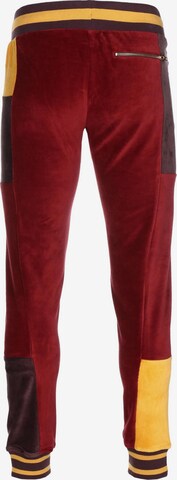 Tapered Pantaloni sportivi 'Tye' di PUMA in rosso