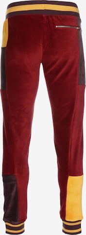 Effilé Pantalon de sport 'Tye' PUMA en rouge