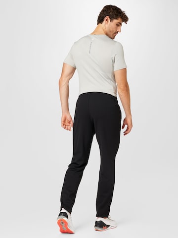 Effilé Pantalon de sport new balance en noir