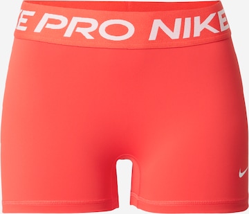 NIKE Workout Pants 'NP 365' in Orange: front
