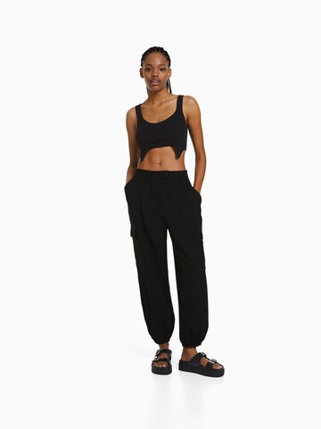 Tapered Pantaloni cu buzunare de la Bershka pe negru