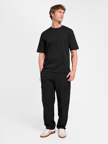 Loosefit Pantalon de sport Hummel en noir