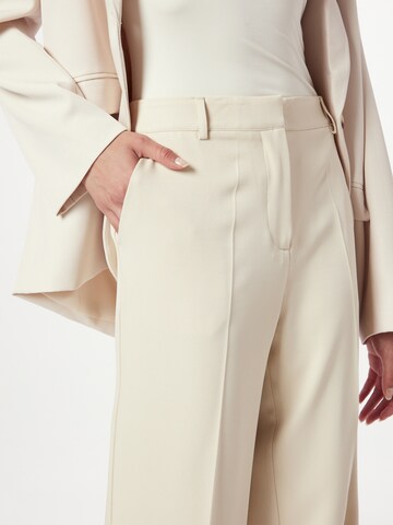 NA-KD Boot cut Trousers with creases in Beige