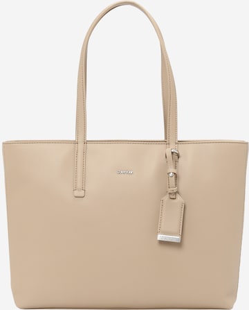 Calvin Klein حقيبة تسوق 'Must' بلون بيج: الأمام