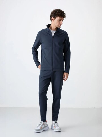 Tommy Life Trainingspak 'Aktive Sets' in Grijs