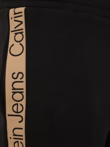 Tapered Pantaloni di Calvin Klein Jeans Curve in nero