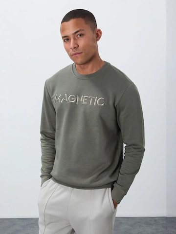 Sweat-shirt Tommy Life en vert : devant