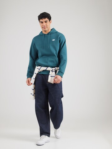 new balance Tréning póló 'Sport Essentials' - kék