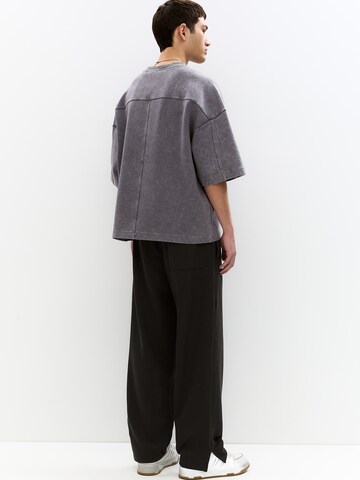 Largi Pantaloni 'STWD' de la Pull&Bear pe negru