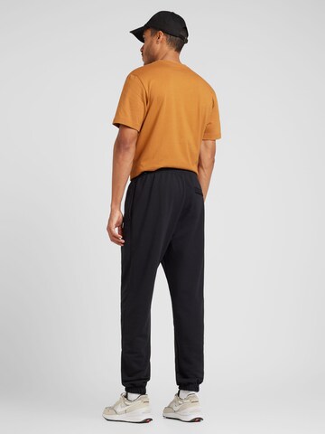 NIKE Tapered Sporthose 'SWOOSH' in Schwarz