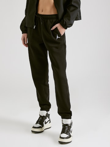 Jordan Tapered Trousers in Black: front