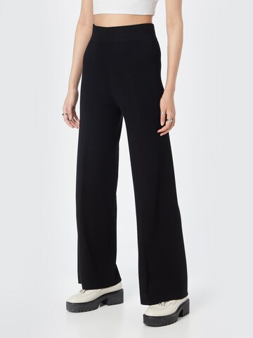 DRYKORN Flared Trousers 'NUMB' in Black: front