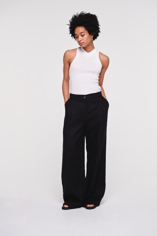 Wide leg Pantaloni con pieghe 'Hainault' di Aligne in nero