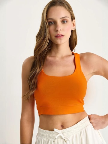 Haut Bianco Lucci en orange : devant