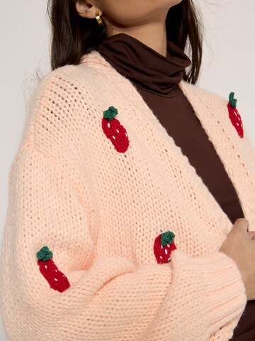 Cardigan Apricot en orange