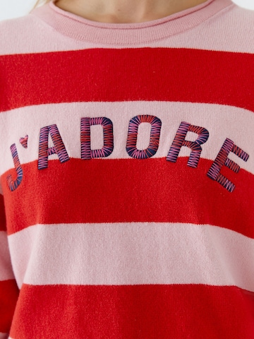 OUI Neulepaita värissä vaaleanpunainen