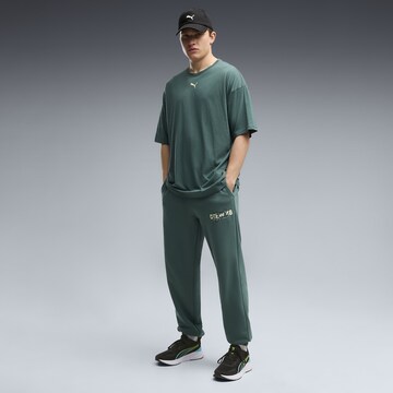 PUMA Regular Sports trousers in Green