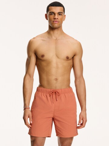 Shiwi Kratke kopalne hlače 'NICK' | oranžna barva: sprednja stran