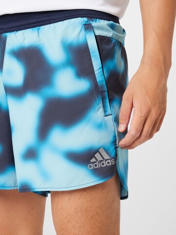 ADIDAS SPORTSWEAR Regularen Športne hlače 'Run Icons Logo Graphic Aop' | modra barva