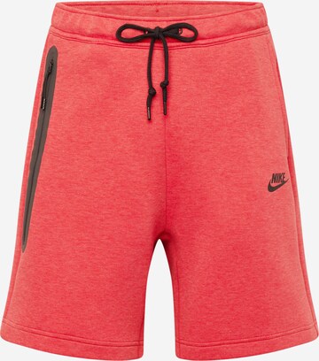 Pantaloni 'Tech Fleece' de la Nike Sportswear pe roșu: față