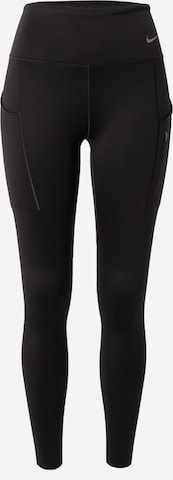 NIKE Skinny Workout Pants in Black: front