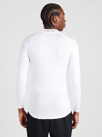 T-Shirt fonctionnel 'Mock' NIKE en blanc