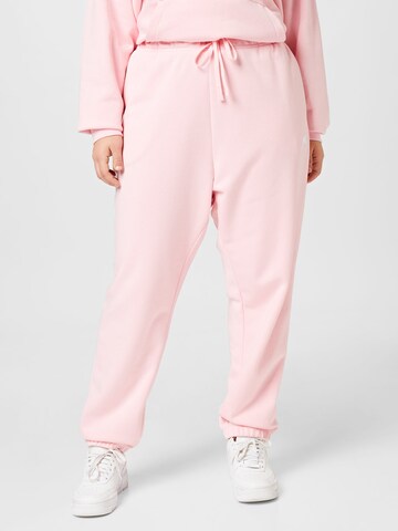 Nike Sportswear Tapered Workout Pants in Pink: front