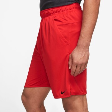 NIKE Regular Workout Pants 'Totality' in Red