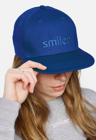 Casquette smiler. en bleu : devant