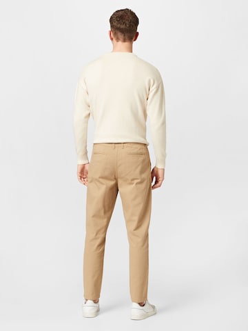 regular Pantaloni con pieghe 'Azad' di ABOUT YOU in beige