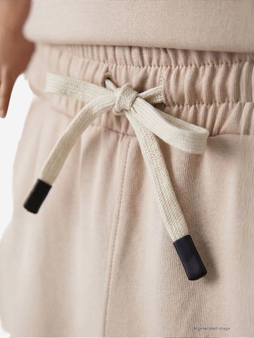 Completo per l'allenamento di Tommy Life in beige