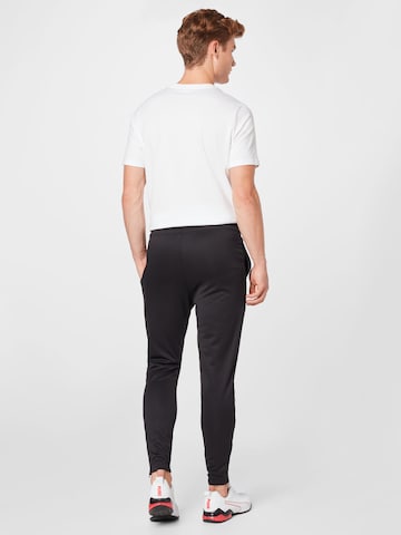 PUMA Tapered Sportbroek 'TeamRise' in Zwart