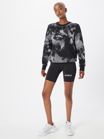 Reebok Skinny Sportbroek 'Les Mills' in Zwart