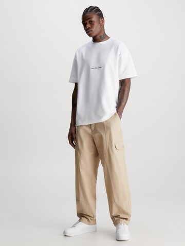 Largi Pantaloni cu buzunare de la Calvin Klein Jeans pe bej