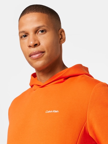 Bluză de molton de la Calvin Klein pe portocaliu