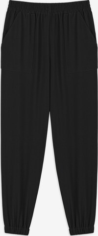 Twist Tapered Pants in Black: front